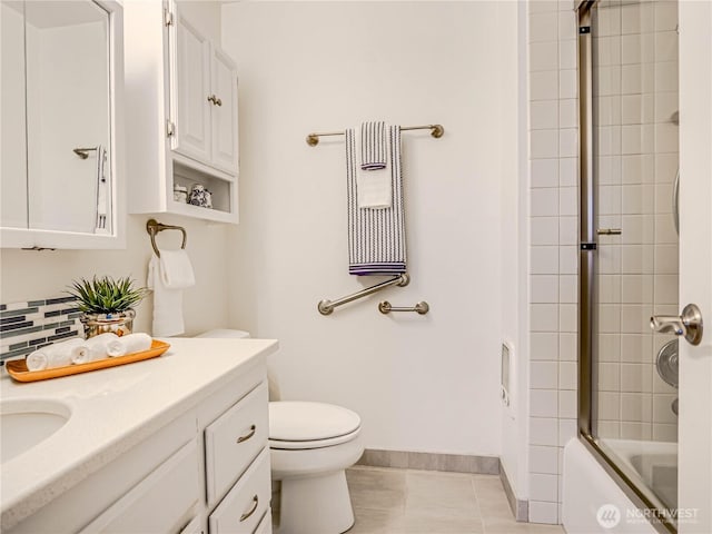 bathroom featuring bath / shower combo with glass door, toilet, decorative backsplash, vanity, and tile patterned floors