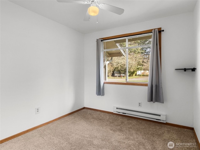 carpeted spare room with baseboards, baseboard heating, and a ceiling fan