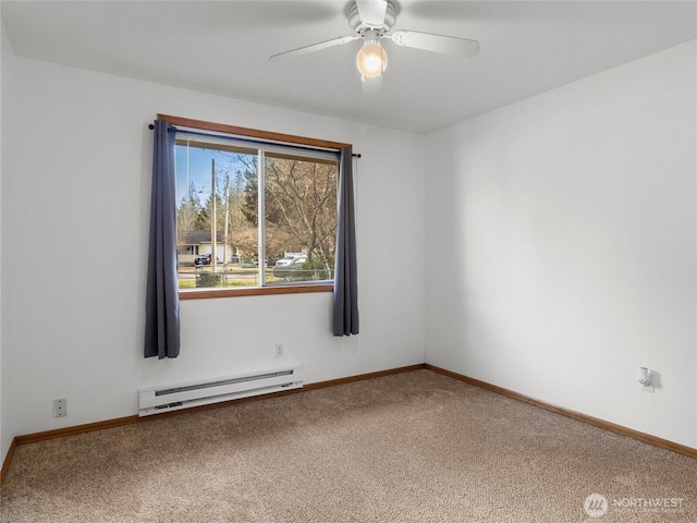 carpeted empty room with a baseboard heating unit, ceiling fan, and baseboards