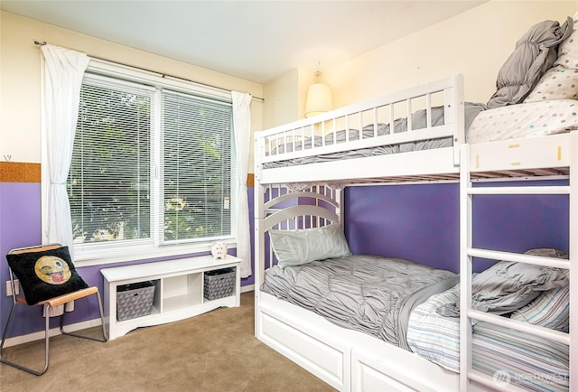 bedroom with baseboards and carpet floors