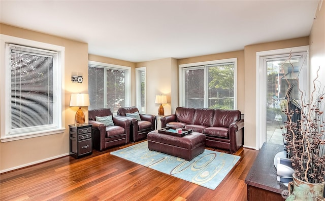 living area featuring wood finished floors and baseboards