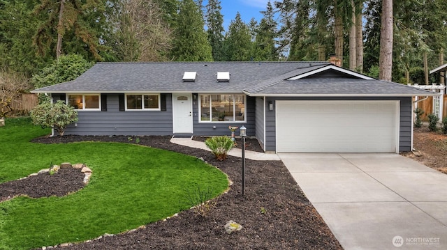 single story home featuring a garage, roof with shingles, concrete driveway, and a front yard