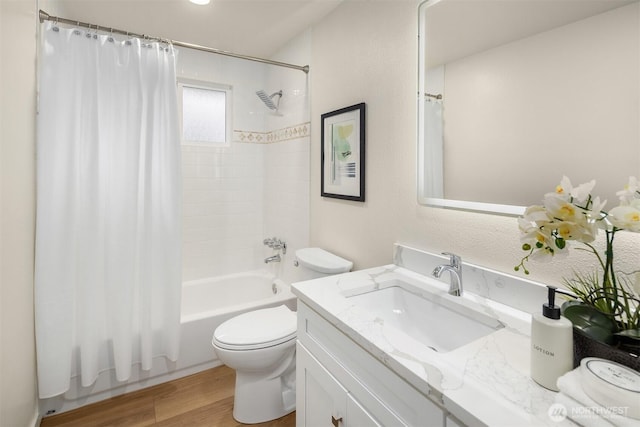 bathroom with vanity, toilet, shower / bath combo, and wood finished floors