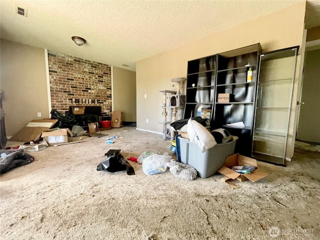 living area featuring visible vents and a textured ceiling