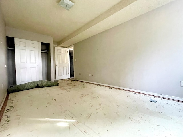 unfurnished bedroom with a closet