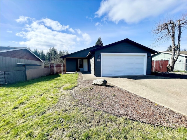 ranch-style house with a garage, a front yard, concrete driveway, and fence