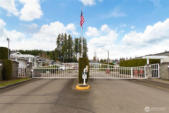 view of gate featuring a residential view