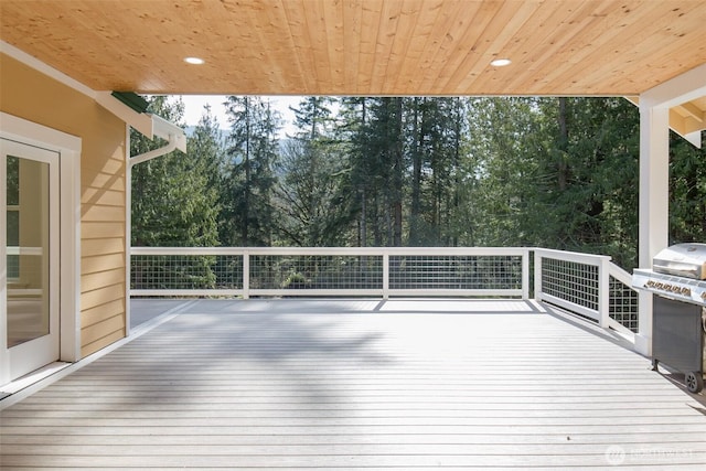 wooden deck featuring area for grilling