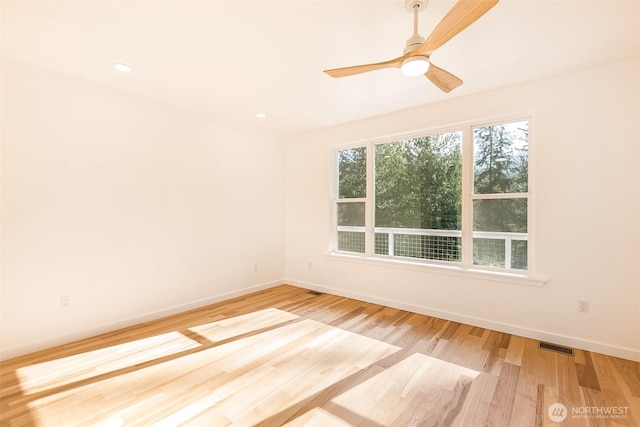 unfurnished room featuring light wood finished floors, ceiling fan, baseboards, and recessed lighting