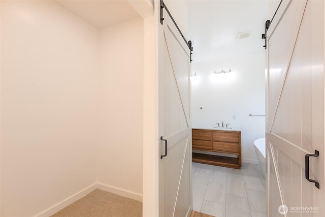 bathroom featuring visible vents and baseboards