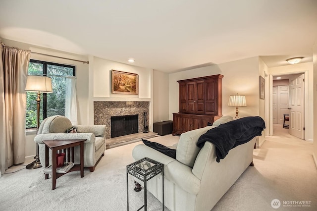 living room with a fireplace, recessed lighting, light colored carpet, and baseboards