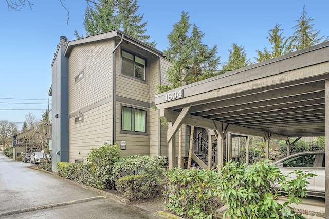 view of side of property with stairs