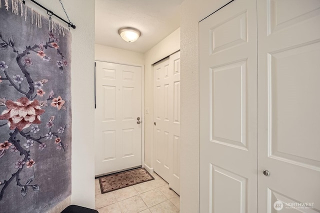 interior space featuring light tile patterned flooring