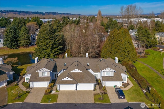 birds eye view of property with a residential view