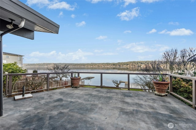 view of patio with a water view