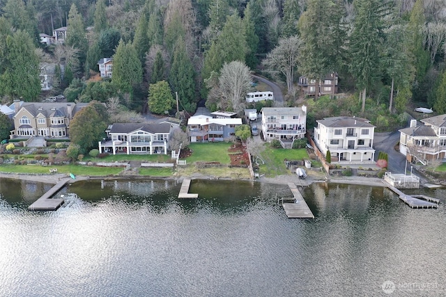 birds eye view of property featuring a residential view and a water view