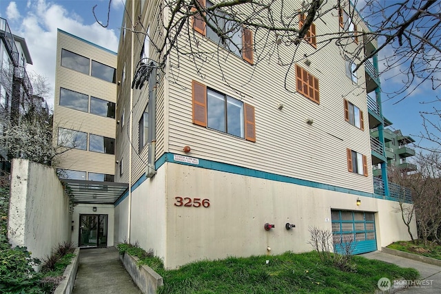 view of building exterior with an attached garage