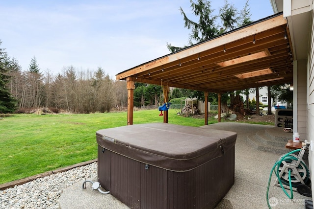 view of patio / terrace with a hot tub