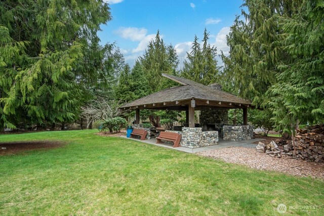 view of yard featuring a gazebo and a patio