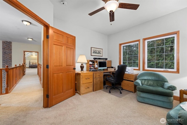 office with ceiling fan and light carpet