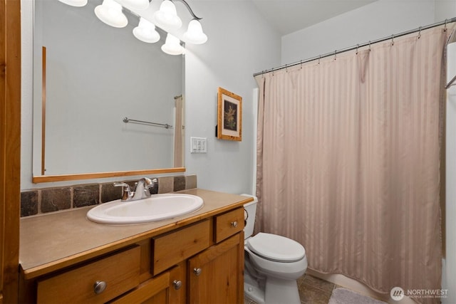 full bath featuring tile patterned floors, a shower with curtain, toilet, a chandelier, and vanity