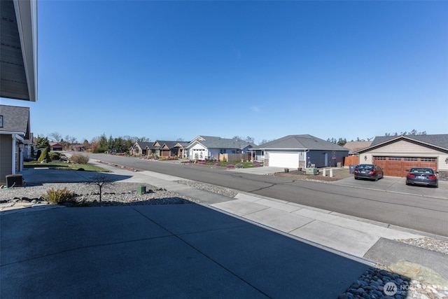 view of road featuring sidewalks and a residential view