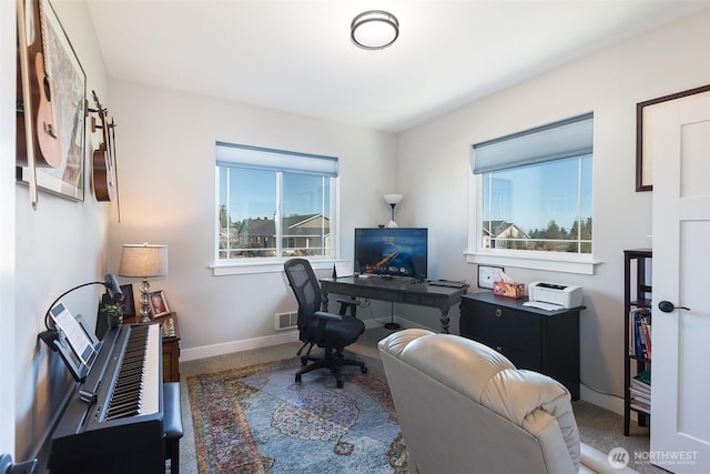 office area featuring visible vents and baseboards