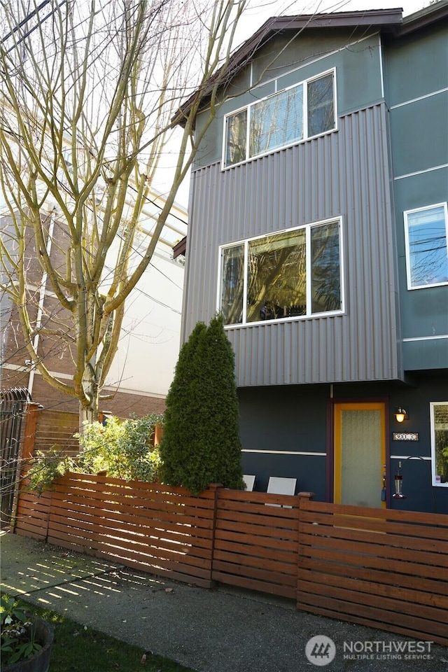 view of home's exterior with a fenced front yard