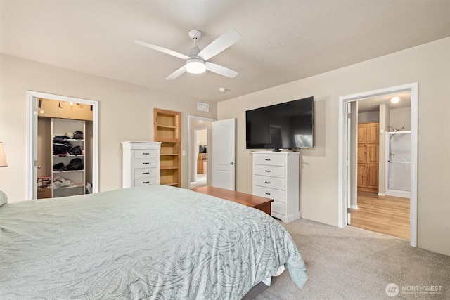 bedroom with a closet, visible vents, a ceiling fan, and carpet