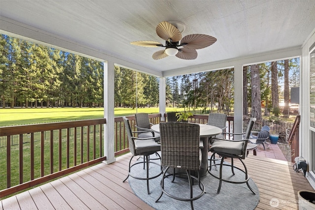 sunroom / solarium with ceiling fan