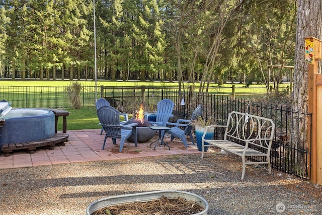 view of patio / terrace featuring a fire pit and a fenced backyard