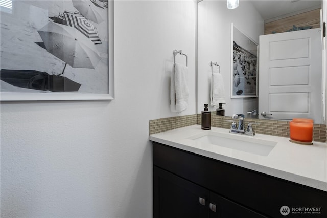 bathroom with decorative backsplash and vanity