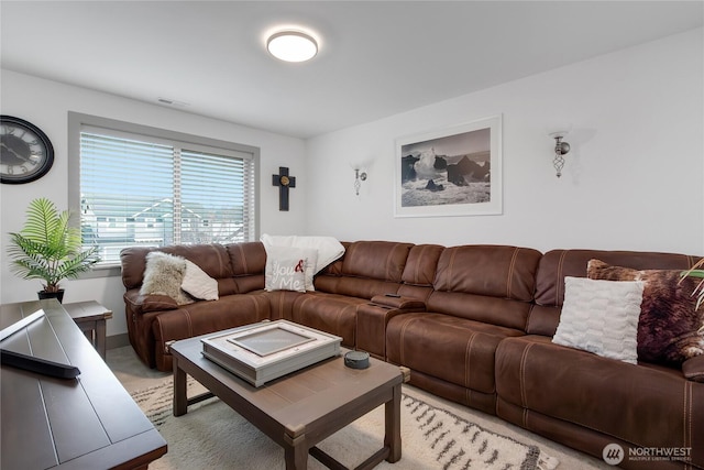 living area featuring light colored carpet and visible vents