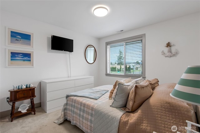 bedroom with light carpet, visible vents, and baseboards