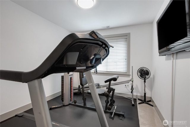 workout area with visible vents and baseboards