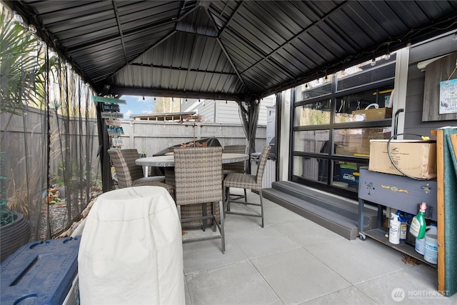 view of patio / terrace featuring fence and outdoor dining area