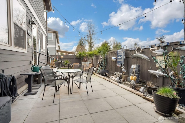 view of patio / terrace featuring outdoor dining area and a fenced backyard