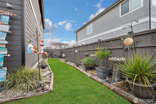 view of yard with a fenced backyard