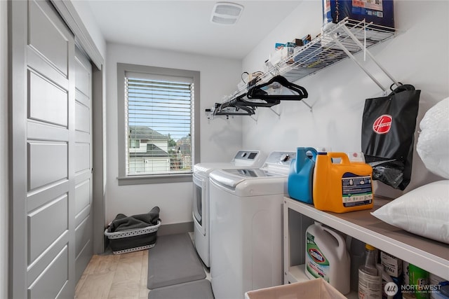 laundry area featuring laundry area and washer and clothes dryer