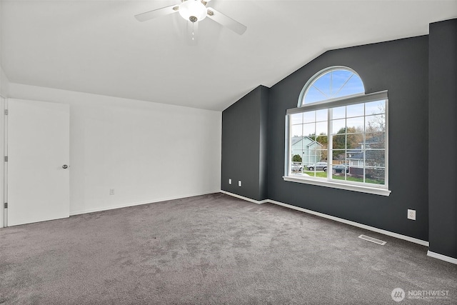 additional living space with lofted ceiling, ceiling fan, baseboards, and carpet flooring