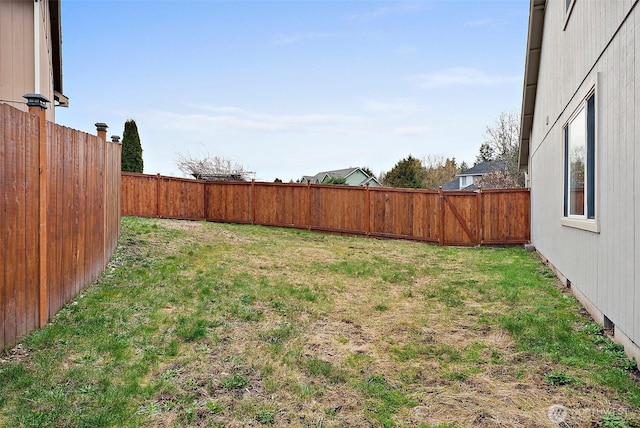 view of yard featuring a fenced backyard