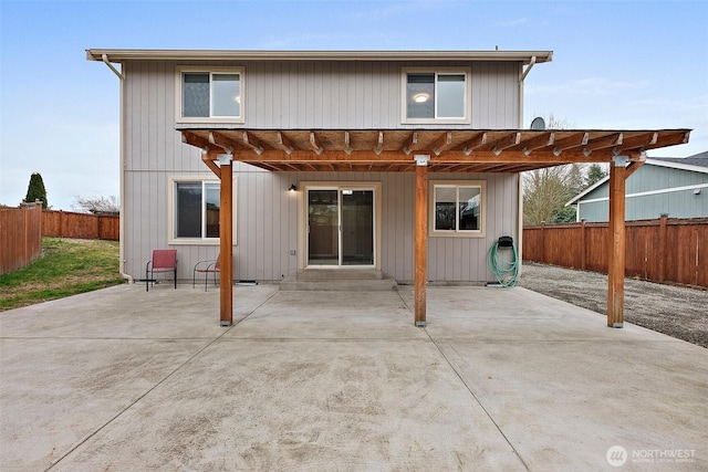 rear view of property featuring entry steps, a patio, and fence