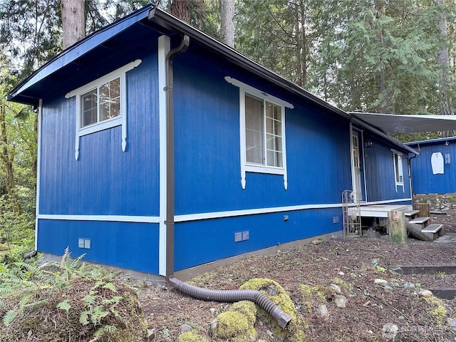 view of home's exterior featuring crawl space