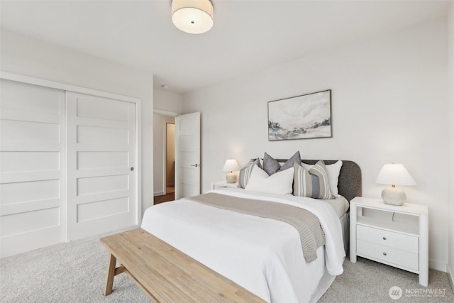 carpeted bedroom with a closet