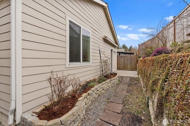 view of property exterior featuring fence