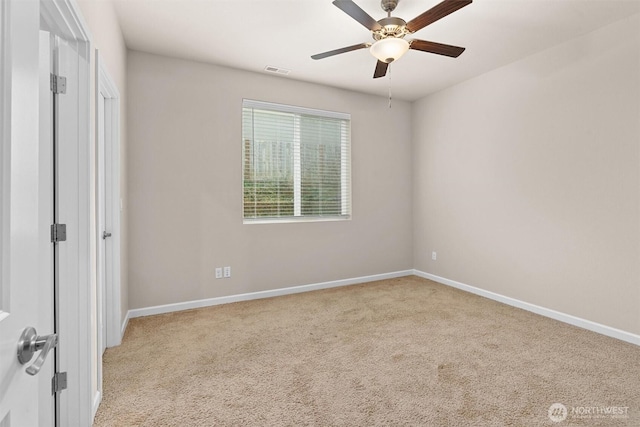 interior space featuring baseboards, visible vents, and ceiling fan