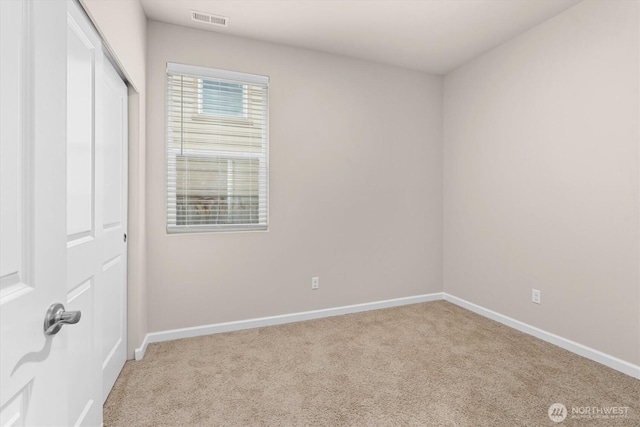 unfurnished bedroom with a closet, visible vents, carpet flooring, and baseboards