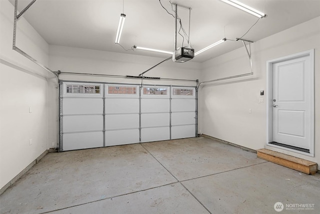 garage featuring a garage door opener