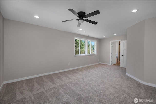 spare room featuring recessed lighting, carpet flooring, and baseboards