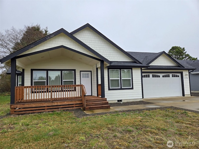 view of front of property featuring driveway, a porch, and an attached garage